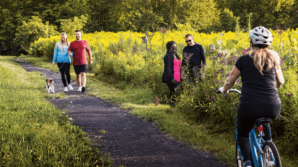 People walking dogs, biking, and enjoying nature along Turkey Run Trail at Mosquito Lake State Park in Northeast Ohio