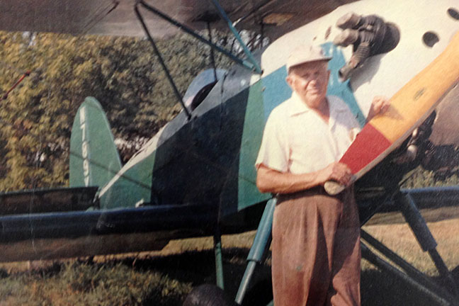 Ernie Hall with plane, Date unknown (Ernie Hall Aviation Museum, Inc. https://www.erniehallaviationmuseum.org/ernie-hall)