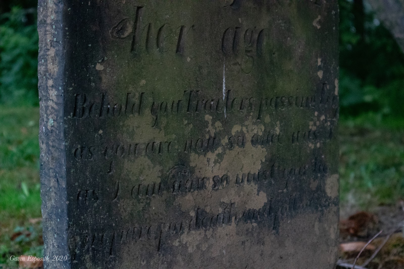 Although darkened by the passing of 187 years, Rhoda Luce Gardiner’s headstone still bears a legible warning regarding the unavoidable event of death: “Behold you Travelers passing by as you are now so once was I As I am now you shall be prepare for death and follow me” (Photo by Gavin Esposito).