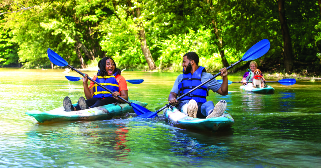 People kayaking on the Mahoning River near Canoe City MetroPark in Trumbull County, Ohio, enjoying scenic paddling and outdoor adventure.