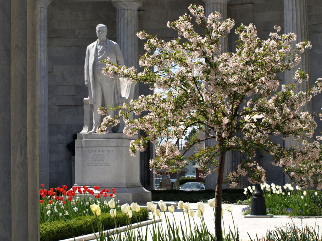 Statue of President William McKinley surrounded by spring flowers at the McKinley Birthplace Memorial in Niles, Trumbull County, Ohio.