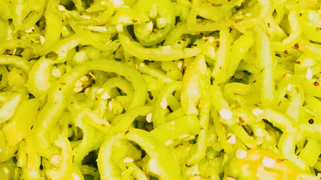 Close-up of sliced hot peppers in oil, a traditional Italian delicacy featured on Trumbull County’s Italian Food Trail in Northeast Ohio.