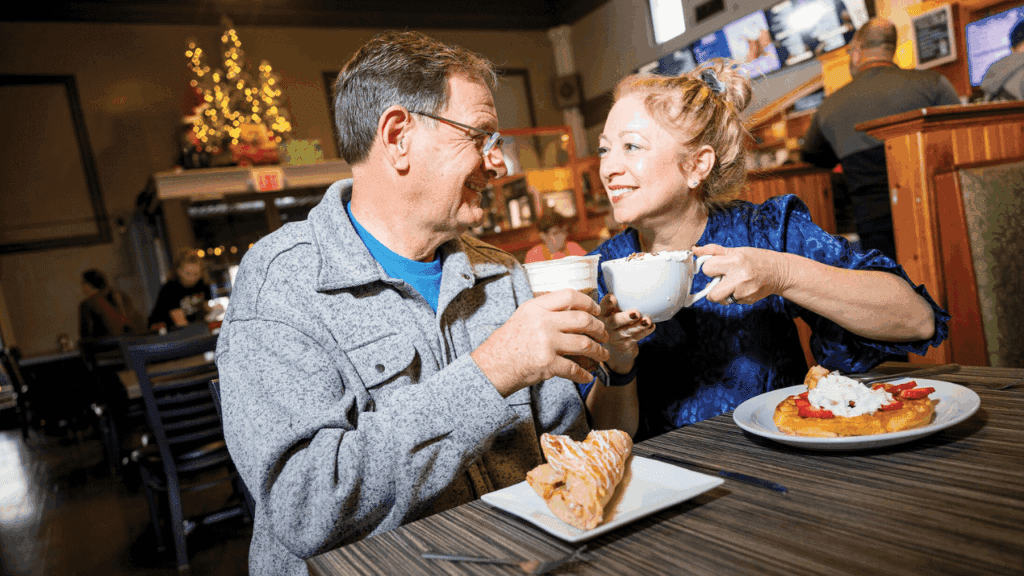Couple enjoying brunch with coffee and pastries at Mocha House café in downtown Warren, Ohio