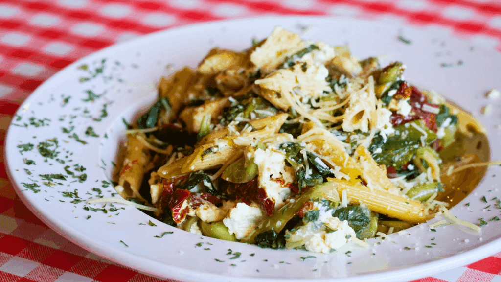 Close-up of an Italian pasta entrée with chicken, sun-dried tomatoes, and spinach at Sunrise Inn restaurant in Warren, Ohio