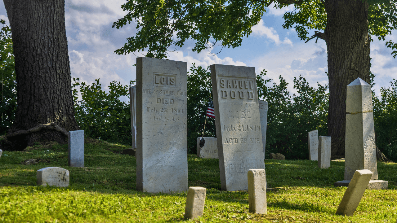 Headstones at historic Doud Cemetery in Vienna Township, Trumbull County, Ohio, marking the final resting place of early settlers.