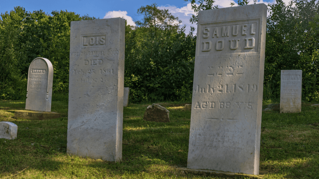 Close-up of 1800s-era headstones in Doud Cemetery, final resting place of early Vienna Township settlers in Trumbull County, Ohio.