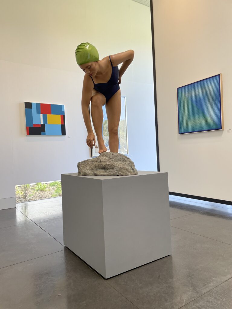 Hyperrealist sculpture of a female swimmer by Carole A. Feuerman on display at the Medici Museum of Art in Howland, Ohio.