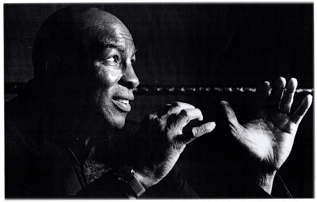 Black-and-white portrait of a heavyweight boxer in fighting stance; Braceville archival image featured in the documentary.