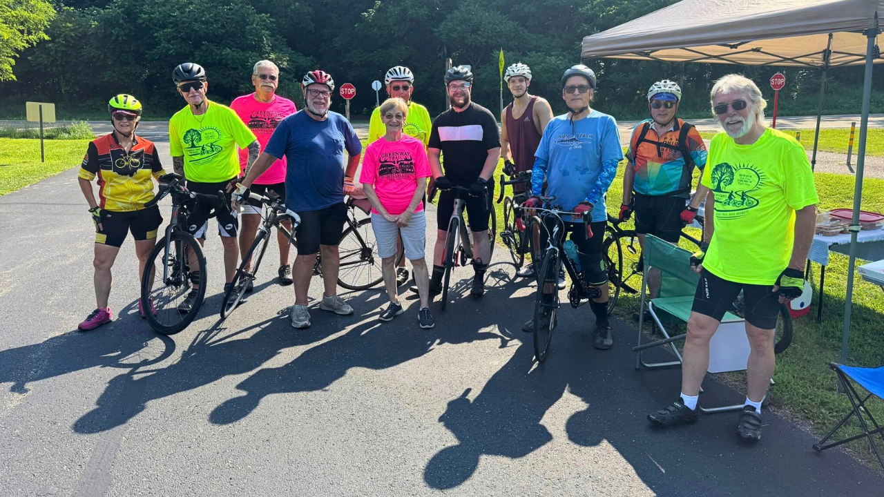 Group of cyclists posing at a rest stop during the Northeast Ohio Century bicycle tour in Trumbull County, Ohio.