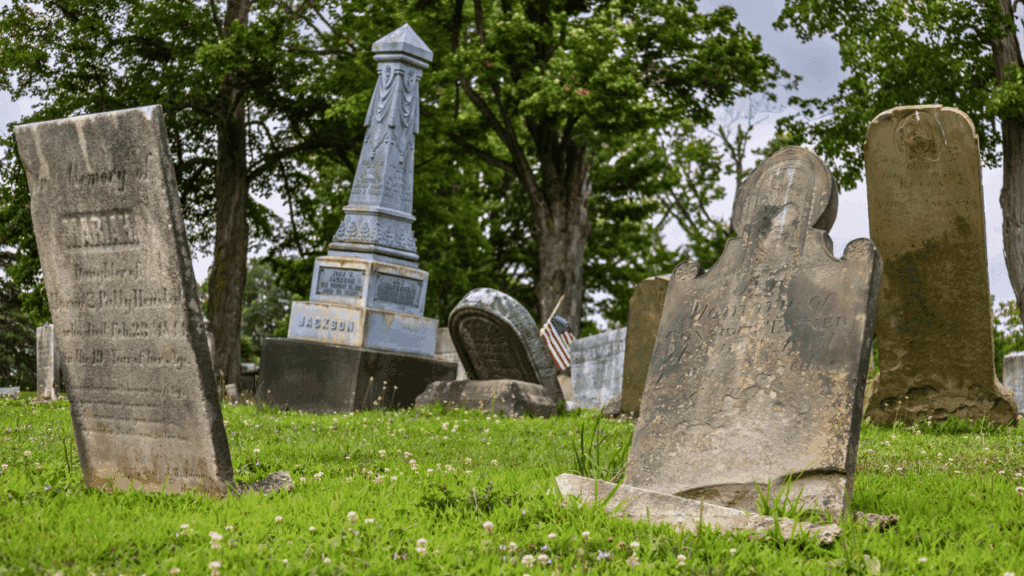 19th-century headstones and an obelisk monument at Evergreen Cemetery in Johnston Township, Trumbull County, Ohio, one of Northeast Ohio’s earliest pioneer burial sites.