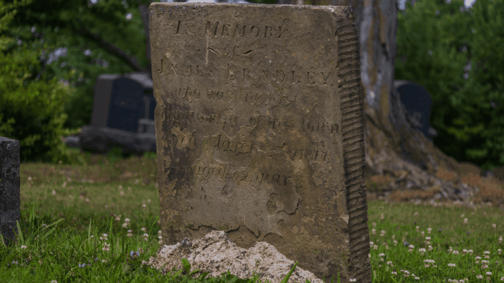 Brownstone gravestone of James Bradley, first settler of Johnston Township and Revolutionary War veteran, buried in Evergreen Cemetery, Trumbull County, Ohio.
