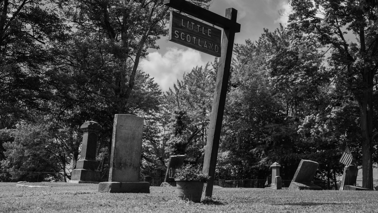 Historic “Little Scotland” section of Evergreen Cemetery in Johnston Township, Ohio, with 19th-century gravestones honoring Scottish immigrants and early settlers.