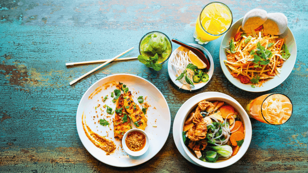 Colorful Vietnamese dishes and drinks served at An’s House in downtown Warren, Ohio, featuring pho, banh mi, and fresh ingredients.