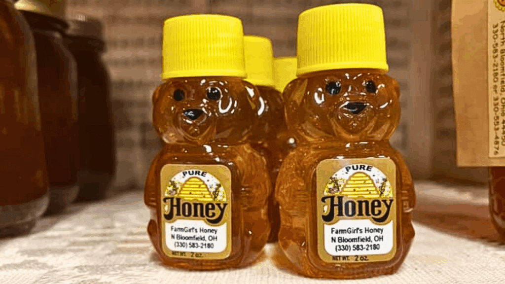 Mini honey bear bottles of FarmGirl’s Honey in North Bloomfield, Ohio, featuring locally made pure honey from Trumbull County.