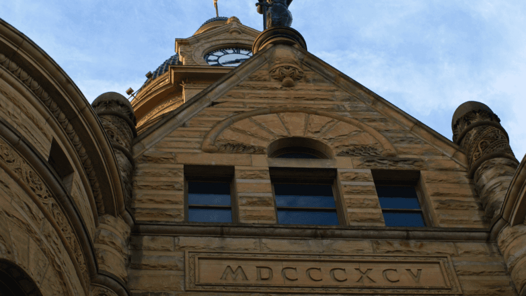 Detail of the 1895–97 Trumbull County Courthouse gable with “MDCCCXCV,” Courthouse Square, Warren, Ohio.