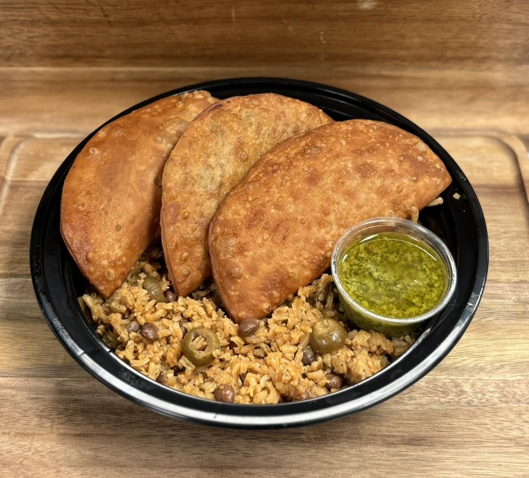 Puerto Rican dish consisting of a cripsy pastry filled with cheese served over spicy rice with sauce